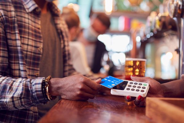 customer paying with credit card in taproom